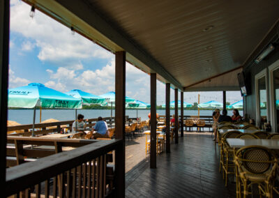 Deck view of the Quarry restaurant with tables and umbrellas