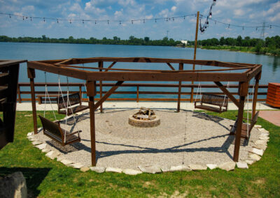 Bonfire and swings at the Quarry restaurant patio overlooking the water