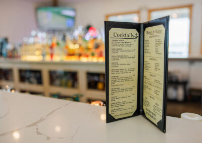 Cocktail menu sitting on a bar